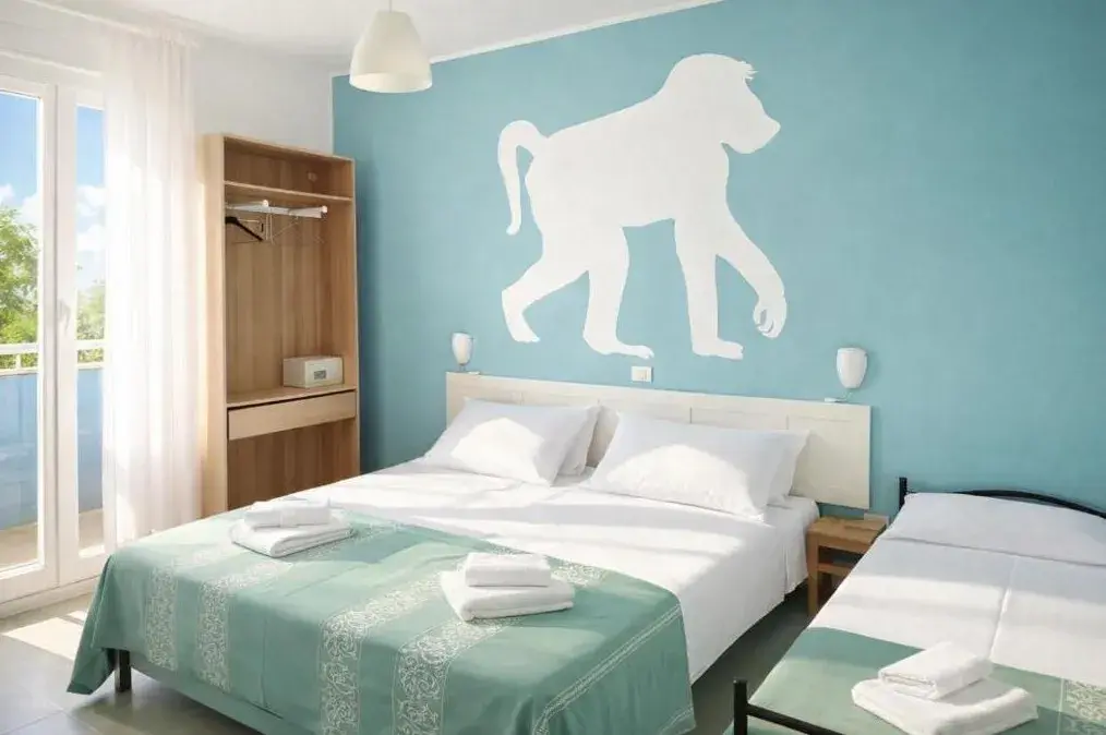 Camera tripla con letto matrimoniale, letto singolo e balcone